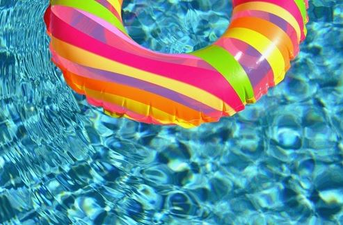 Picture of a colorful swim ring floating on shimmering pool water in Little Rock Arkansas
